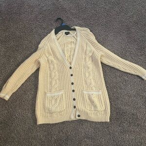 Torrids ladies size 1 or XL cardigan. Cream and white colored